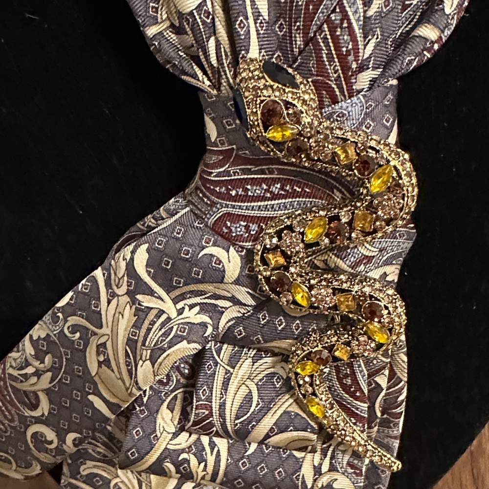 Elegant Paisley Silk Tie with Gold rhinestone snake on beaded necklace.